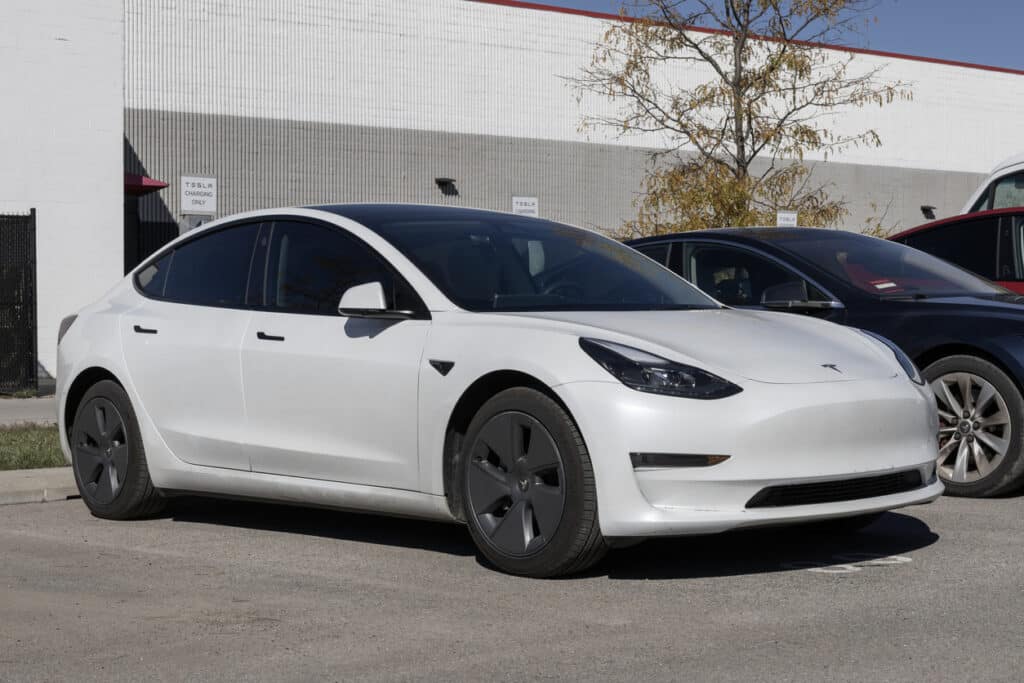tesla model 3 at charging station