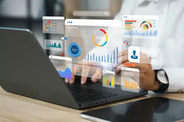 Data showing from a laptop with someone analysing it